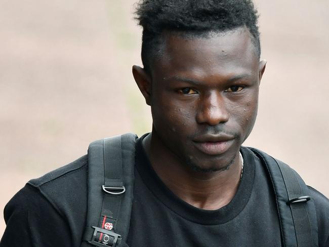 The Malian migrant seemed slightly overwhelmed as he collected the temporary residence permit he was awarded after the incredible rescue. Picture: AFP Photo / Gerard Julien