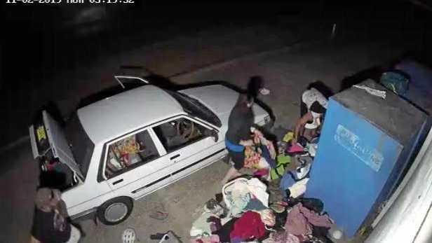 CAR FULL: Three people loading a car with items donated at the Toormina Lifeline store. Picture: Contributed