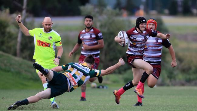 19th September 2020, Nerang Bulls player Nathan Mcanalley breaks the defensive line during the Gold Cast District Rugby Union First Grade clash between Nerang Bulls and Surfers Paradise Dolphins Photo: Scott Powick News Corp