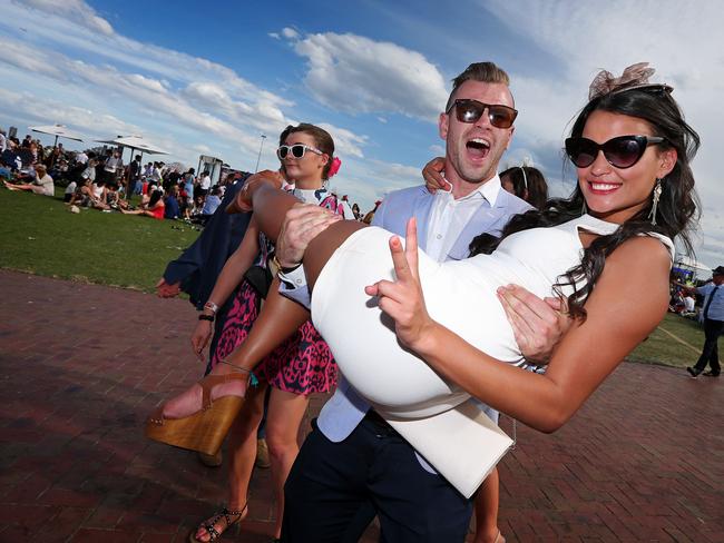 Melbourne Cup Day 2014 at Flemington Racecourse. Punters start to get a little raucous after the cup. Picture: Mark Stewart