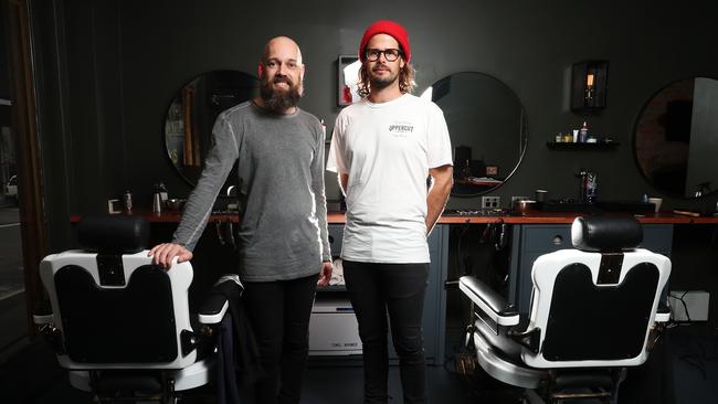 Brady Monks and Philip Curd barber at Monks & Co in midtown Hobart. Picture: NIKKI DAVIS-JONES