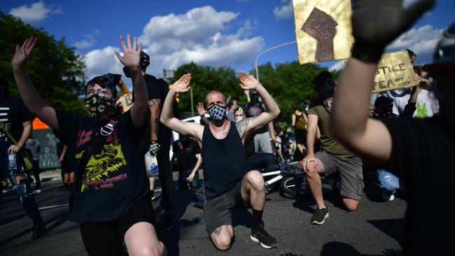 Protesters raise their hands in front of a police line in Philadelphia. Picture: Mark Makela/Getty Images/AFP.