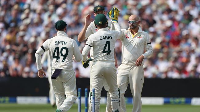 Lyon congratulates Alex Carey on the stumping of Jonny Bairstow. Picture: Getty