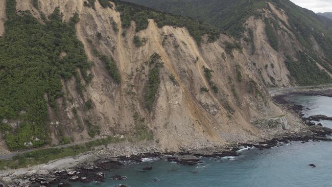 Huge slips, caused by the 7.5 earthquake, are seen blocking State Highway One north of Kaikoura. Picture: Photo by Mark Mitchell — Pool/Getty Images.