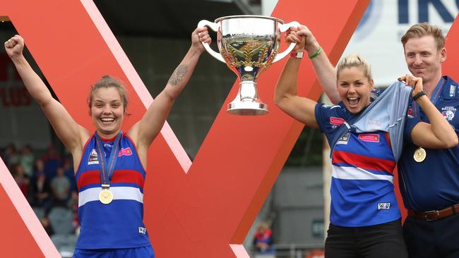 Ellie Blackburn, left, and Katie Brennan, who missed the match through suspension, after winning the 2018 AFLW grand final with the Western Bulldogs