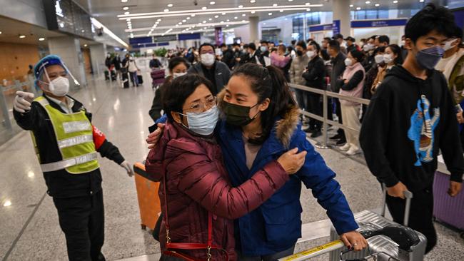 A reunion at Shanghai’s Pudong airport on Sunday. Picture: AFP