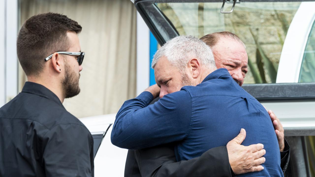 Gabriella McLennan’s father (in blue) is seen hugging Tyrese’s grandfather. Picture: NCA NewsWire / Monique Harmer