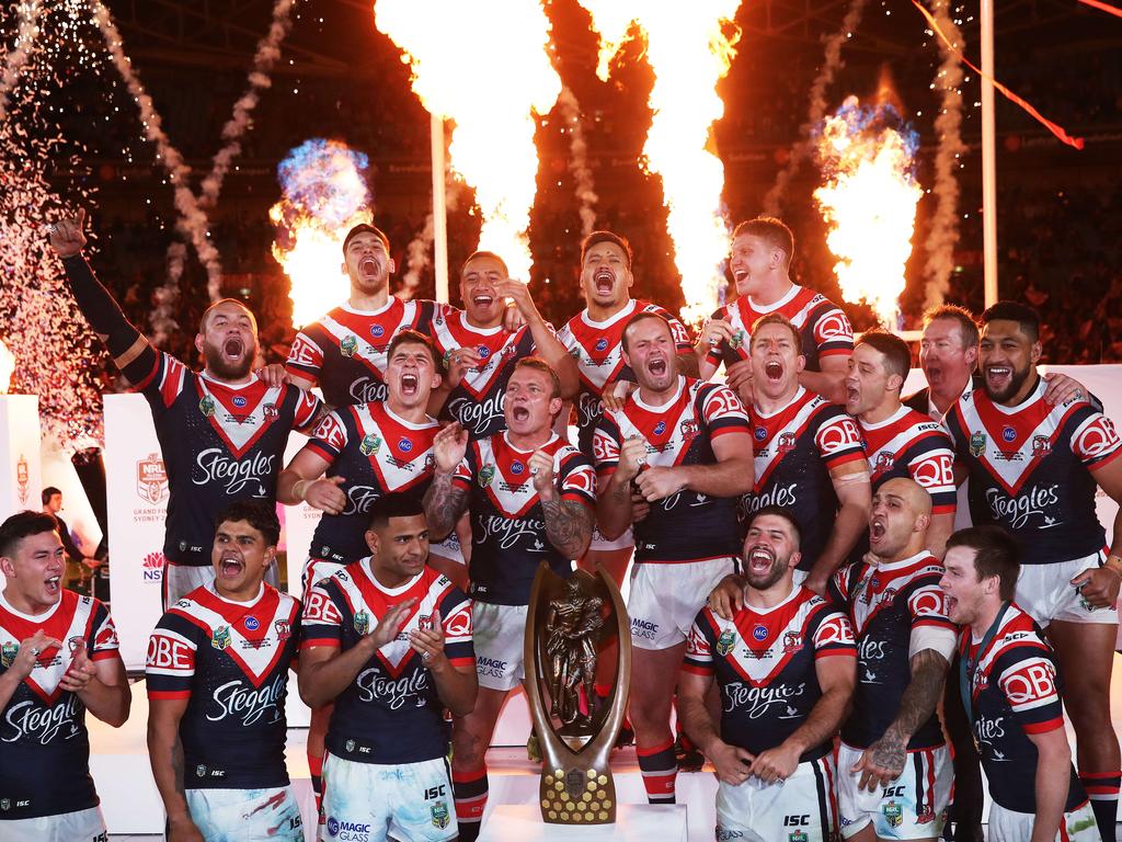 The Sydney Roosters celebrate with the Provan-Summons Trophy after defeating the Melbourne Storm in the 2018 NRL Grand Final at ANZ Stadium. Picture. Phil Hillyard