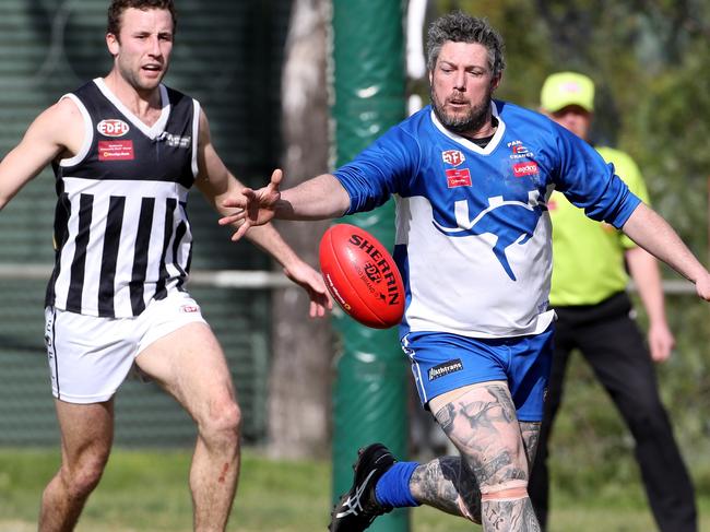 Michael Kilty leads the race for the footy. Picture: Mark Dadswell