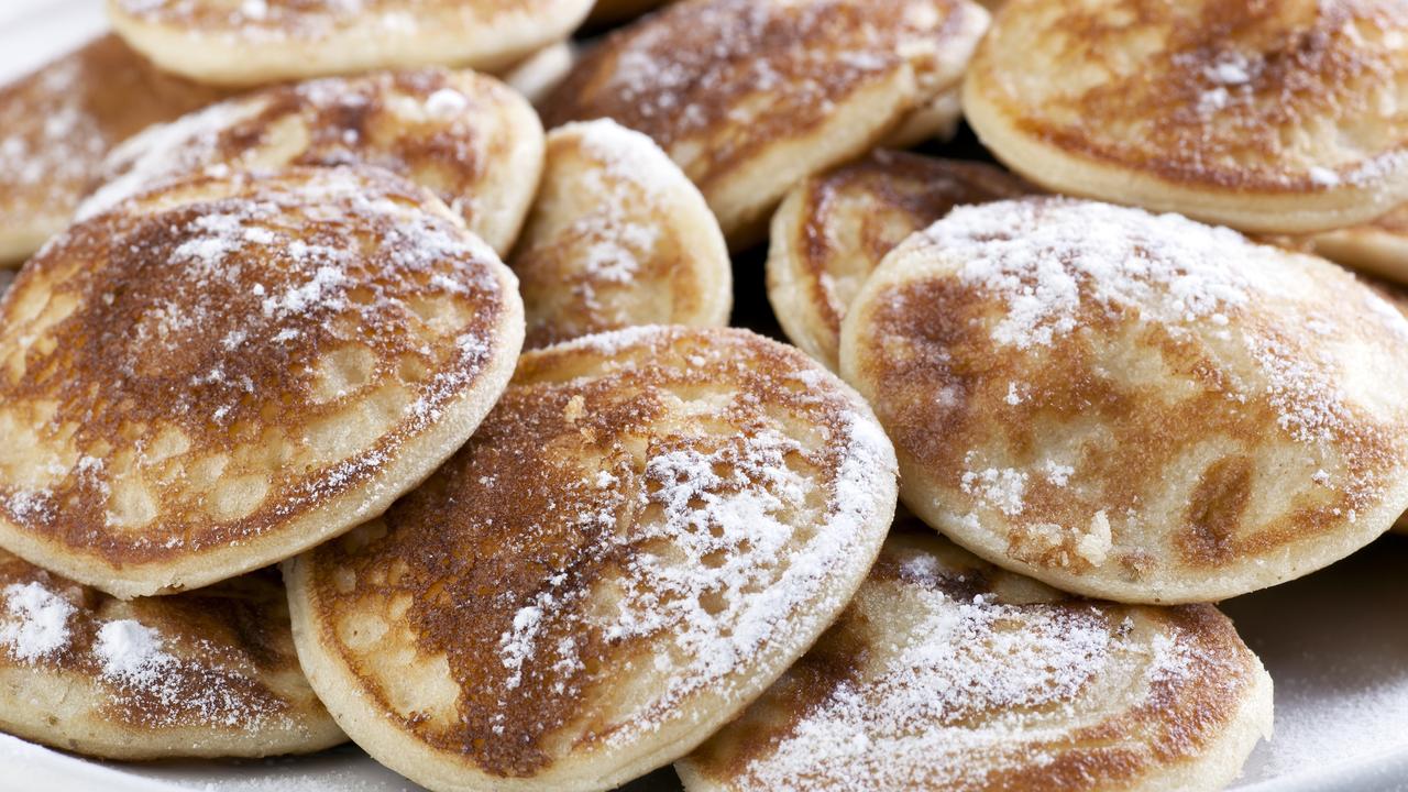 These are poffertjes, small pancakes sprinkled with icing sugar and a version from the Netherlands.