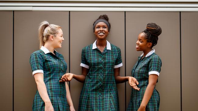 Chloe, Akoi and Nancy, from St Columba College, took part in a trial program teaching young girls about endometriosis. Picture: Matt Turner.