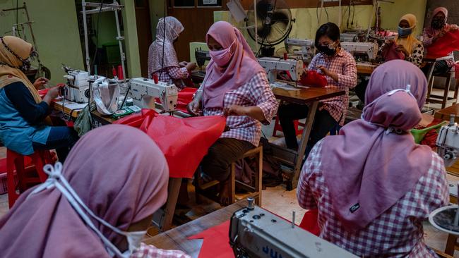 Hazmat suits are produced at the home Industry garment factory in Klaten, Central Java, on Monday. Picture: Getty Images