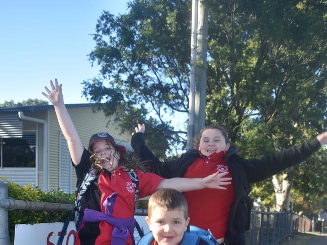 Gympie students Sonja Gourley, Ivy Robertson and Davis Mahoney (front) celebrate the return to normal school at Gympie West State School yesterday. Picture: Frances Klein