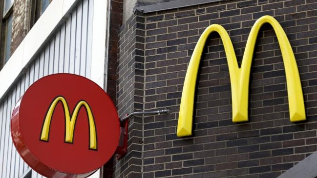 In this Monday, April 24, 2017, file photo, corporate signage hangs at a McDonald's restaurant in downtown Pittsburgh. (AP Photo/Keith Srakocic, File)