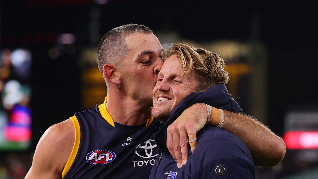 Taylor Walker of the Crows plants a kiss on his best mate Rory Sloane. (Photo by Sarah Reed/AFL Photos via Getty Images)