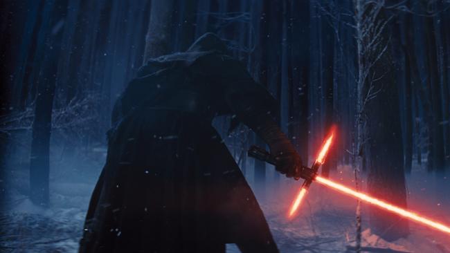 This photo provided by Disney shows, Adam Driver as Kylo Ren with his Lightsaber.