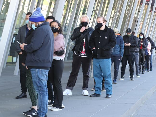 The state is expected to hit its single dose vaccination target of 80 per cent on Tuesday with people shown queuing up to receive a jab. Picture: NCA NewsWire / David Crosling