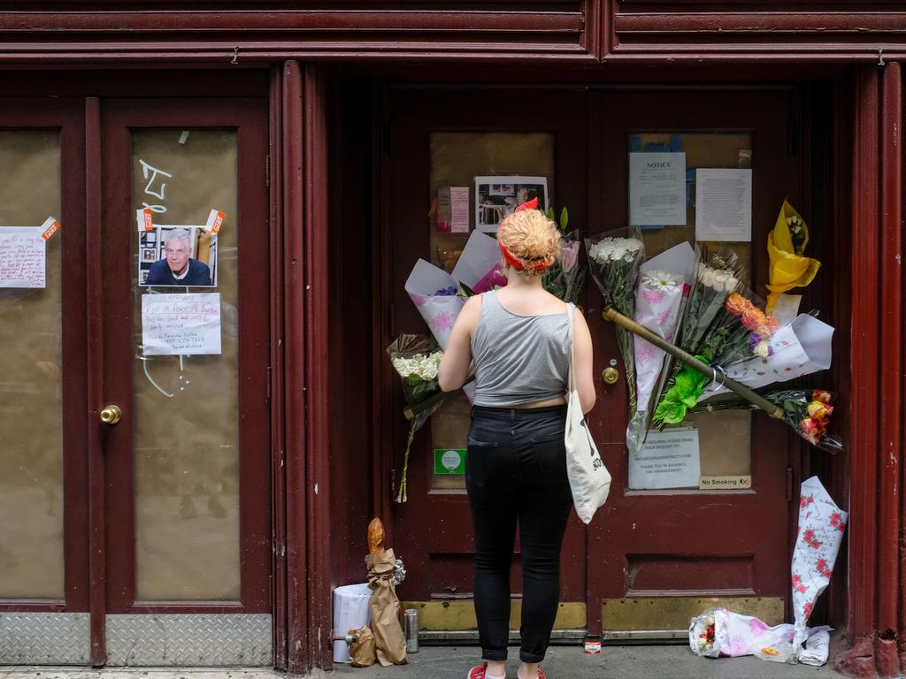 Flowers and notes left in memory of Anthony Bourdain at his Brasserie Les Halles in New York after his death in France. Picture: Drew Angerer