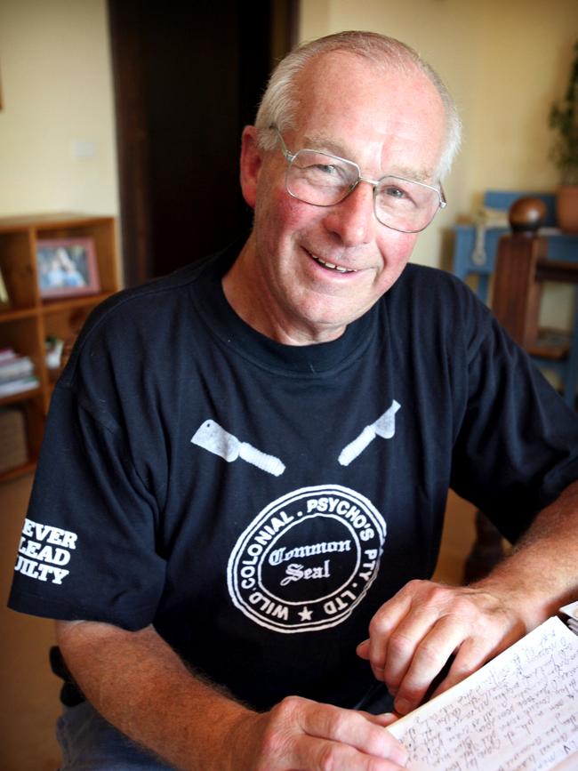 Roger Rogerson at his Padstow Heights, Sydney in 2006 reading through the autobiography he wrote by hand while serving time in prison.