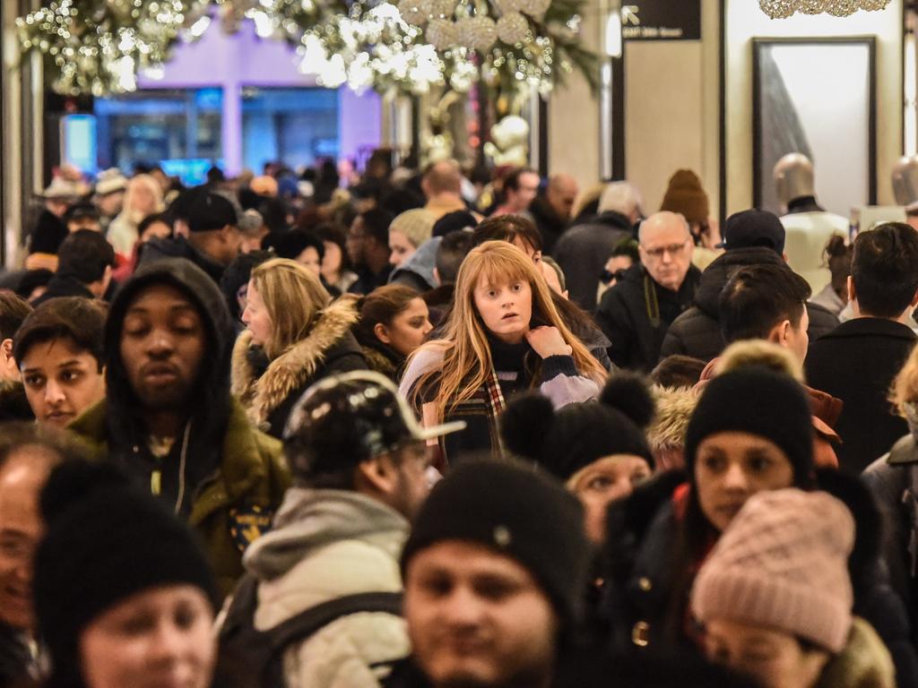 Shoppers huddle in Barneys, New York for Black Friday sales. Picture: Stephanie Keith