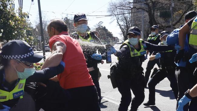 Victoria Police deploy pepper spray on the streets of Melbourne ready for a lockdown protest. Picture: WWW.MATRIXPICTURES.COM.AU