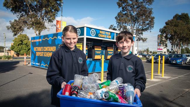 Newcomb Primary School students Sophiia Daffy and Jasper Alford at the Container Deposit Depot in the Newcomb Central car park. Picture: Brad Fleet