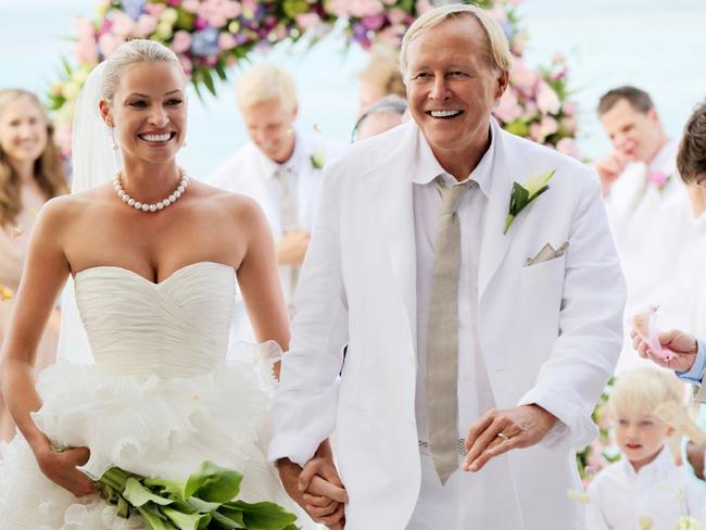 Kristy Hinze with billionaire husband Jim Clark during their wedding ceremony on the beach at the Little Dix Day Resort in the Caribbean.