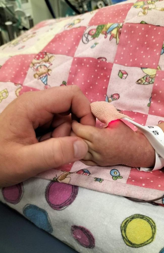 Storm Peterson holding Raevyn Harper's hand. Picture – contributed.