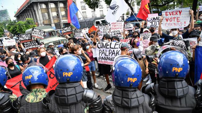 People protesting against the poll result at a rally in front of the electoral commission in Manila on Tuesday. Picture: AFP