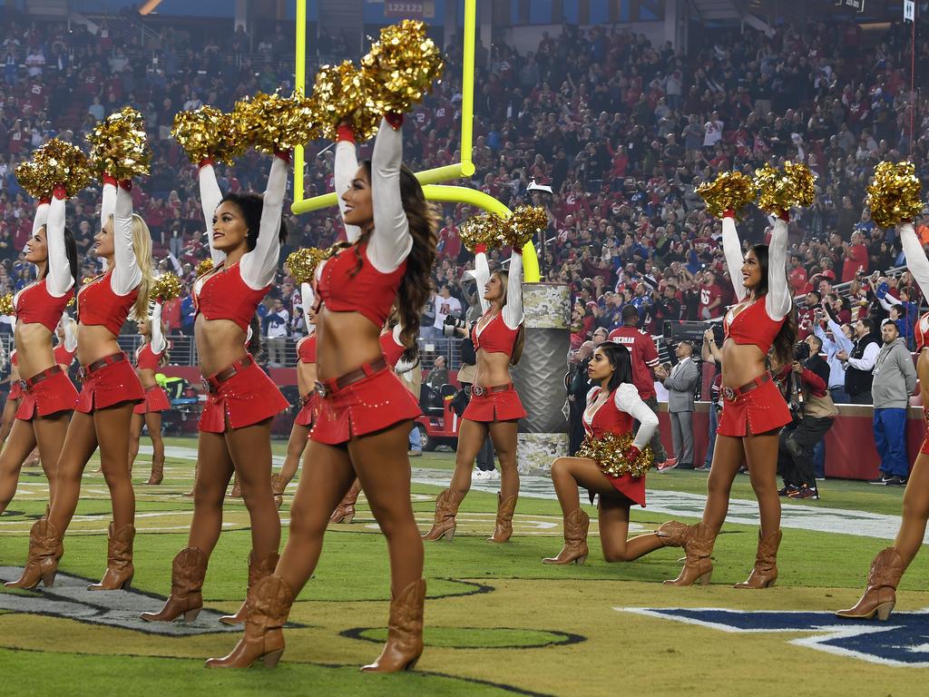 San Francisco 49ers cheerleader takes a knee during national anthem