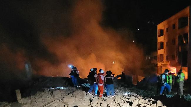 Rescuers and responders work at the site of an Israeli air strike that targeted the southern Lebanese village of Toul. Picture: AFP.