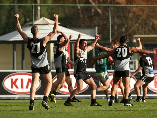 John Colaidis of Roxburgh Park (centre) celebrates with team mates on the final siren after EDFL Division 2 grand final. Picture: Hamish Blair