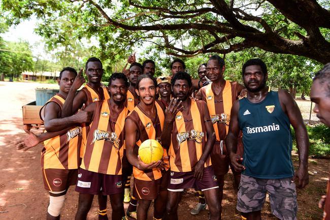 Members of the Tapalinga Superstars gather ahead of the grand final match against the Ranku Eagles on Sunday during this year's 49th Annual Tiwi Grand Final on Bathurst Island which is part of the Tiwi Islands chain, north of Darwin, NT. Picture: Justin Kennedy