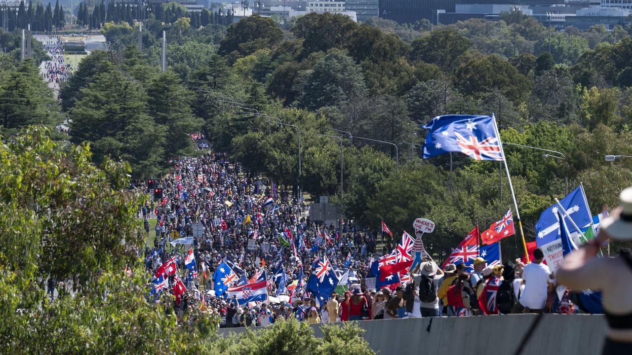 The demonstrators carried flags as they marched. Picture : NCA NewsWire / Martin Ollman