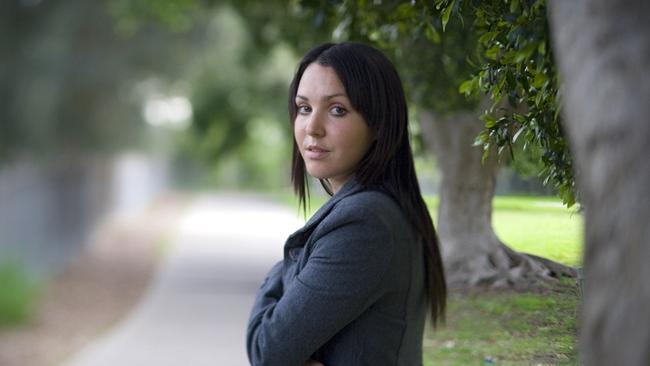 Nina as a 23-year-old standing in front of the tree where she was assaulted by an unknown man. (Pic: Supplied)