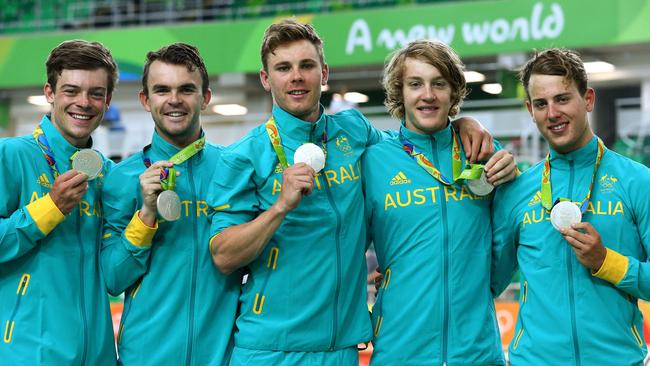 Australia's Men's Team Pursuit team including Callum Scotson (preliminary round rider) Jack Bobridge, Michael Hepburn, Sam Welsford and Alex Edmondson win the silver medal at the 2016 Rio Olympics at the Rio Olympic Velodrome. Alex Edmondson presents prelim rider Callum Scotson with his silver medal. Pics Adam Head