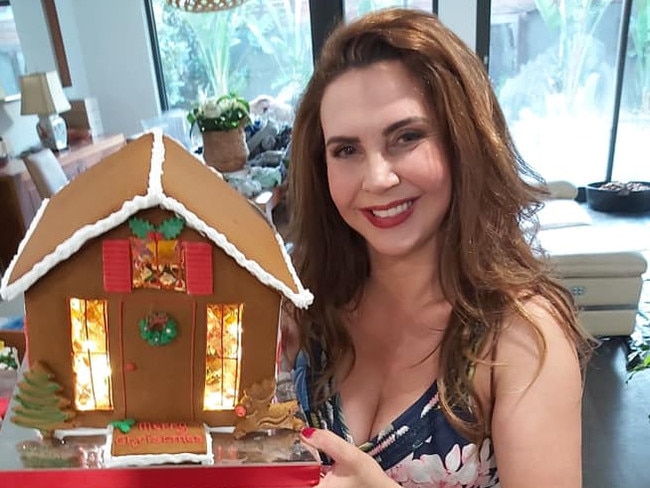 Stonnington mayor Melina Sehr with one of the gingerbead houses made by her business Wonder Ever After. Picture: Facebook