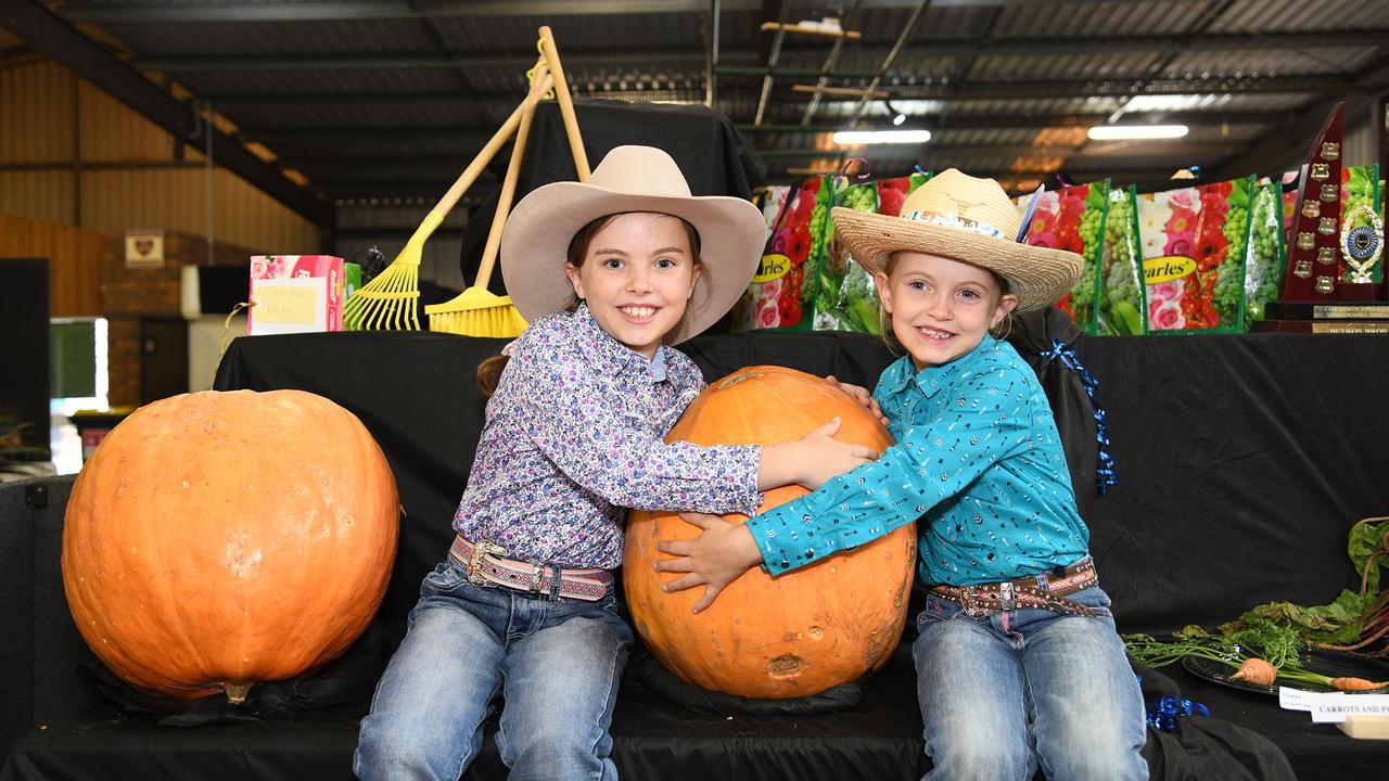 Isla Martin (9) and her sister Lacey Martin (6) and their prize winning pumpkins. Heritage Bank Toowoomba Royal Show. Saturday March 26, 2022