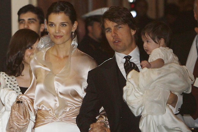 <p>Before they were married ... Katie Holmes and fiance Tom Cruise with their daughter Suri, as their left their hotel in Rome where they celebrated their pre-wedding party in 2006. Photo: AP</p>