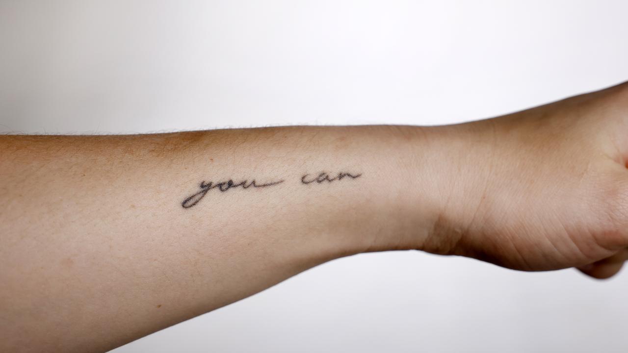 Shyla Heal’s inspiring motto ‘you can’ adorns her arm — and her new shoe as a positive message to those who wear it. Picture: Richard Dobson