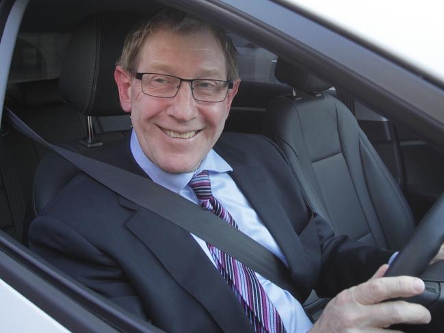 Bruce Flegg leaves LNP headquarters in Spring Hill. Pic Jono Searle.