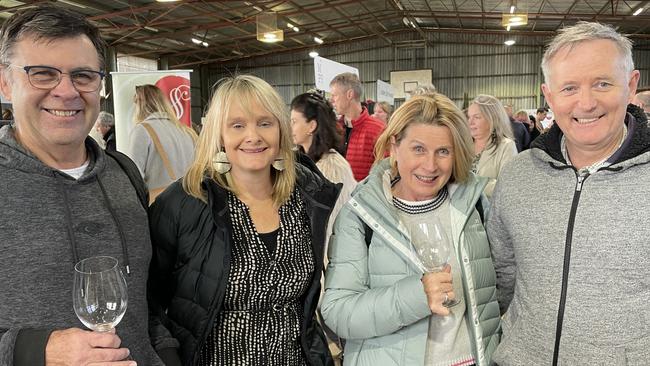 A chilly start to the day didn’t dim the smiles of John and Lisa Pryor, who travelled from Torquay to enjoy the Winter Wine fest with Mary and Dan Moore from Hawthorn. Picture: Lucy Callander