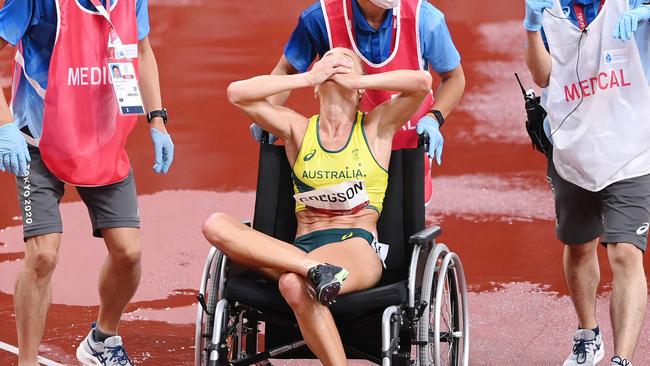 TOKYO, JAPAN - AUGUST 04: Genevieve Gregson of Team Australia reacts as she is wheeled off injured during the Women's 3000m Steeplechase Final on day twelve of the Tokyo 2020 Olympic Games at Olympic Stadium on August 04, 2021 in Tokyo, Japan. (Photo by Matthias Hangst/Getty Images)