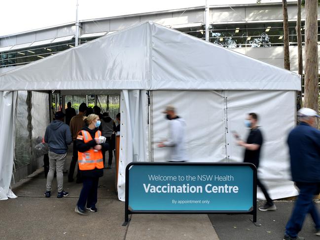 Members of the public queue outside at a mass COVID-19 vaccination hub in Sydney. Picture: NCA NewsWire/Joel Carrett