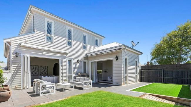 Two remote-controlled awnings create a flexible outdoor entertaining space.