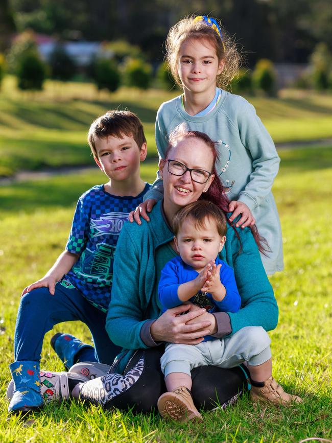 Western Sydney mum Kate Sohl, with her children, RJ, 6, Dieter, 20 months, and Anika, 7. The family has been struggling with the increased cost of living and their school costs are supported by The Smith Family. Picture: Justin Lloyd