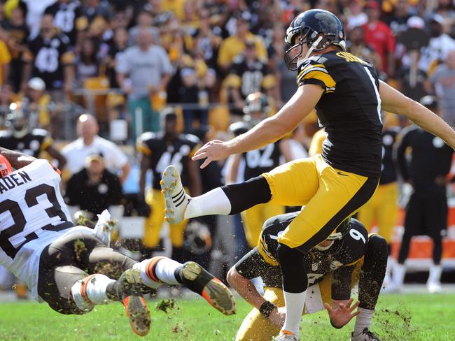 Pittsburgh Steelers kicker Shaun Suisham (6), right, hits a game-winning 41-yard field goal as time runs out in the fourth quarter of an NFL football game, while Cleveland Browns' Joe Haden (23) tries to block it on Sunday, Sept. 7, 2014, in Pittsburgh. The Steelers won 30-27. (AP Photo/Don Wright)