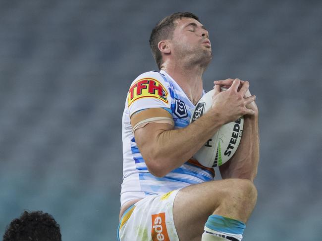 Anthony Don of the Titans soars high to take a bomb during the Round 3 NRL match between the South Sydney Rabbitohs and Gold Coast Titans. Picture: AAP Image/Craig Golding