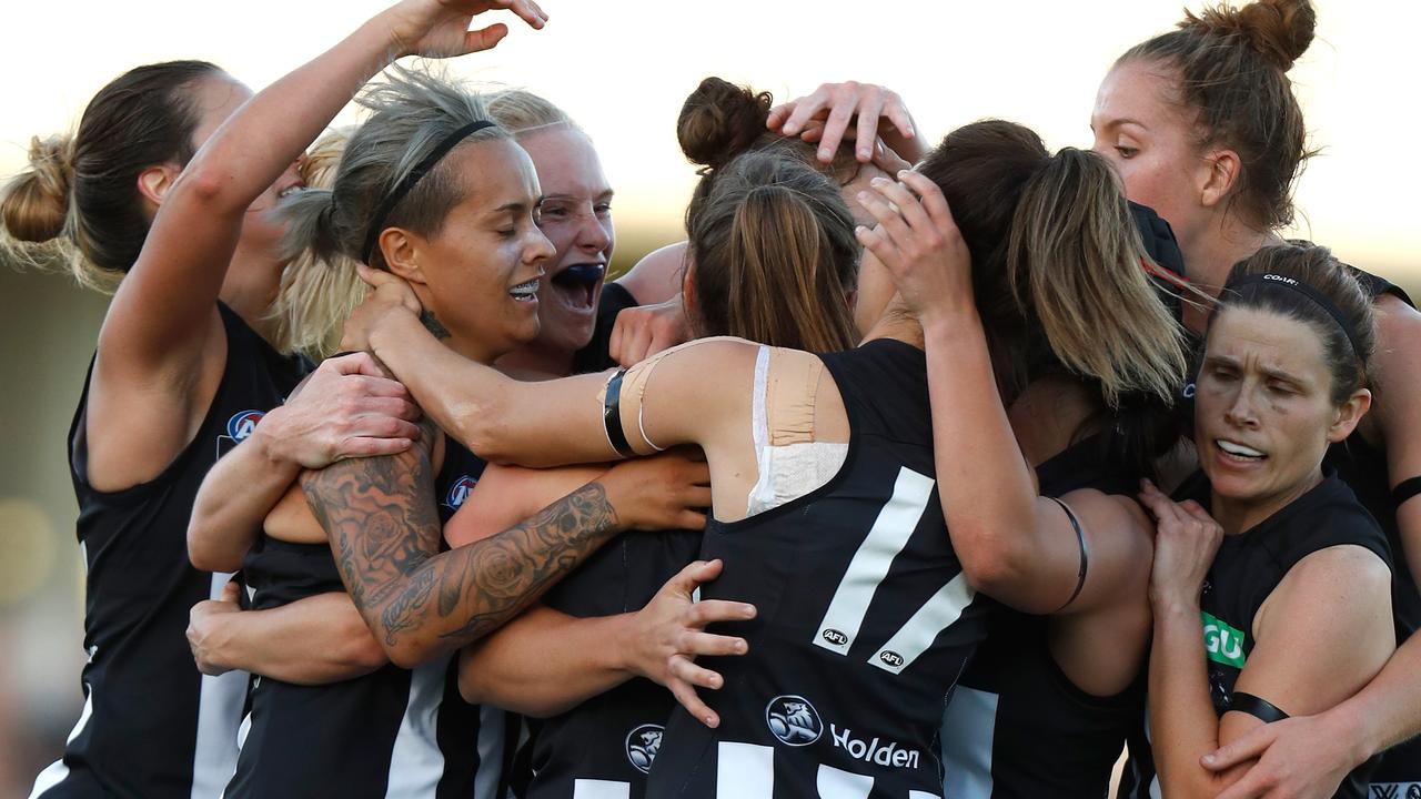 MELBOURNE, AUSTRALIA - FEBRUARY 3: Magpies players celebrate with Jasmine Garner after she kicked the first goal during the 2017 AFLW Round 01 match between the Carlton Blues and the Collingwood Magpies at Ikon Park on February 3, 2017 in Melbourne, Australia. (Photo by Michael Willson/AFL Media/Getty Images)