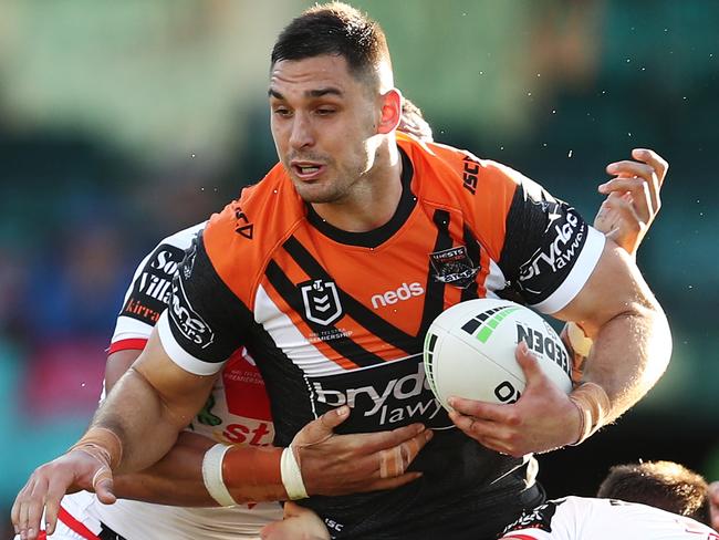 Ryan Matterson of the Tigers is tackled by the Dragons defence during the Round 24 NRL match between the St George Illawarra Dragons and the Wests Tigers at the SCG in Sydney, Sunday, September 1, 2019.  (AAP Image/Brendon Thorne) NO ARCHIVING, EDITORIAL USE ONLY